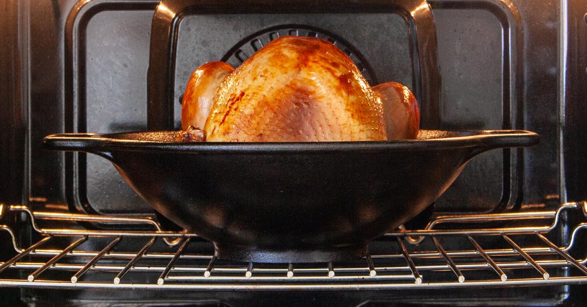 Turkey cooking in oven with a wok
