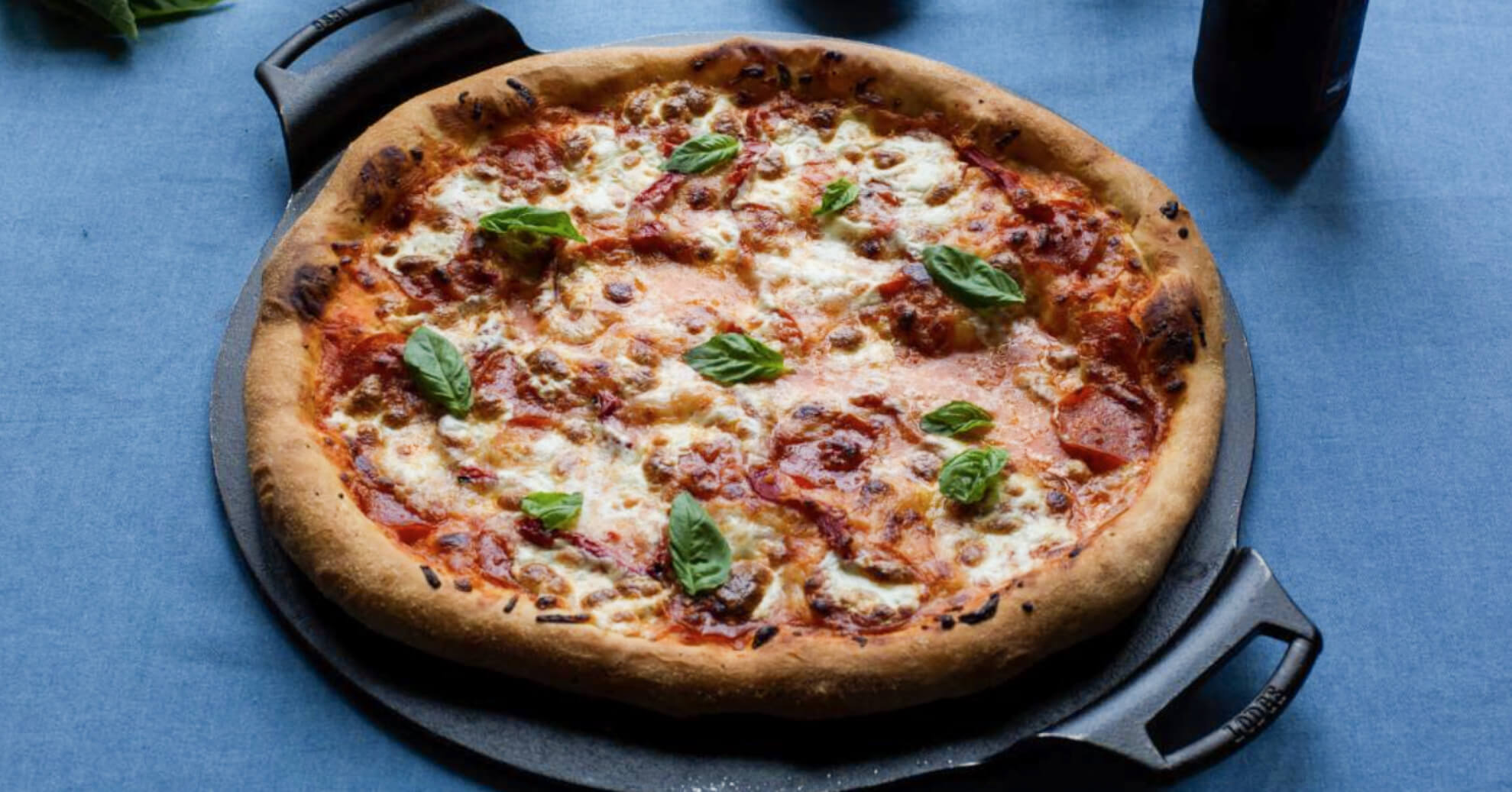 Pepperoni Pizza Topped With Roasted Red Pepper and Basil