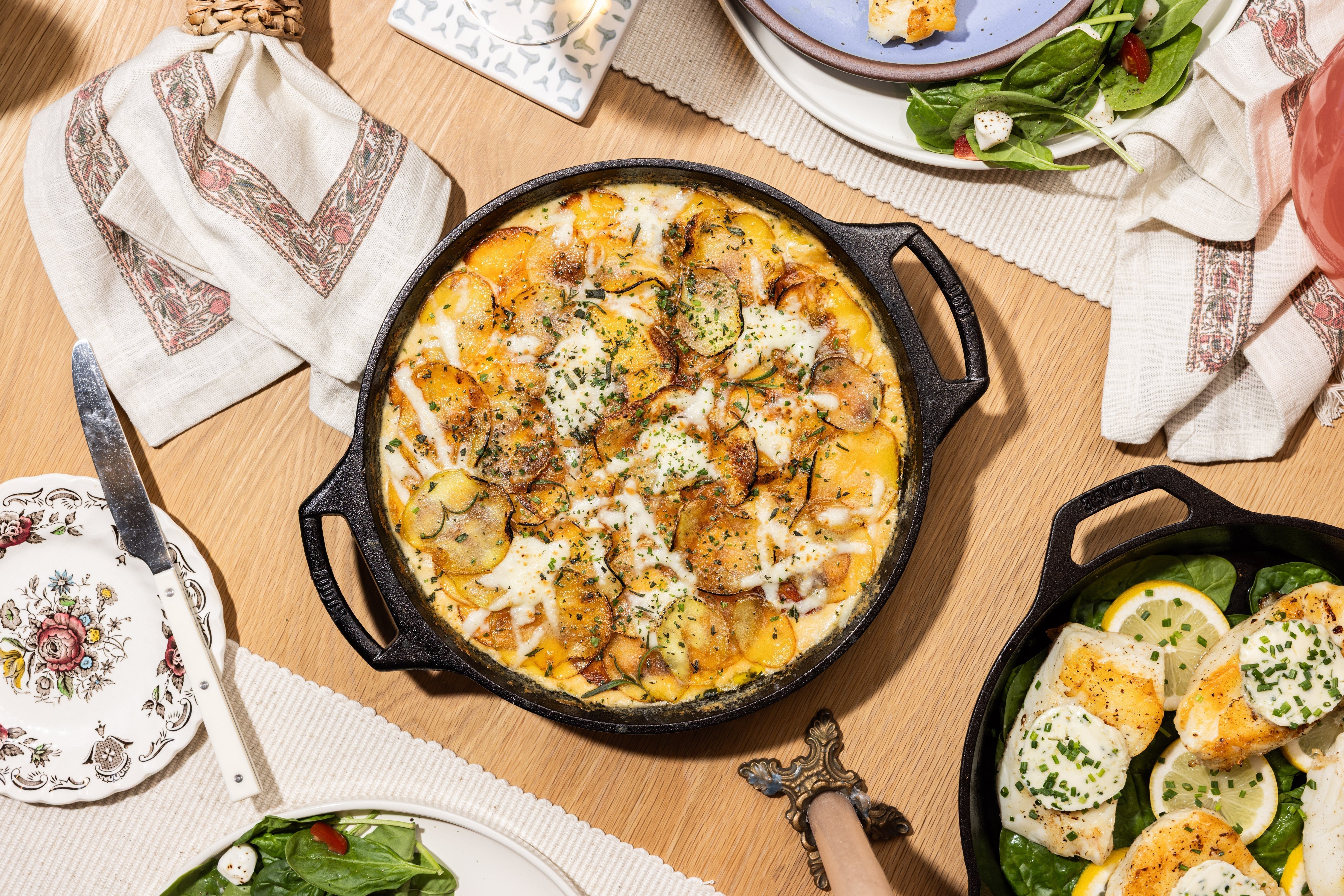 Skillet Scalloped Potatoes served on table