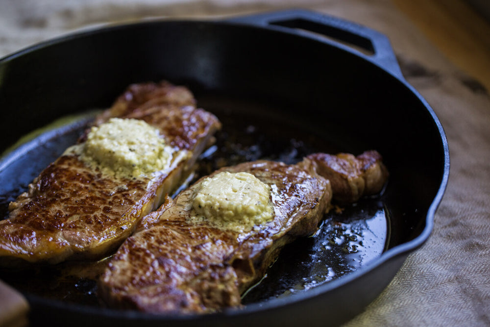 Seared steak topped with butter
