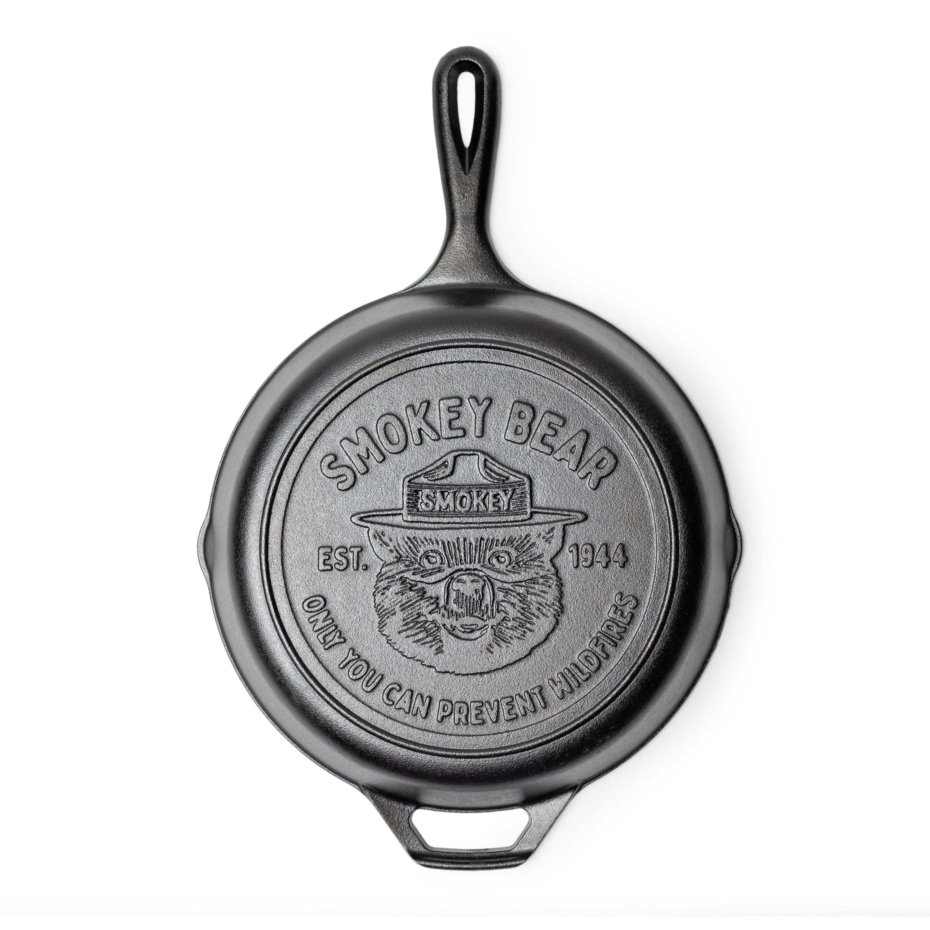 Cast iron skillet with Smokey Bear logo on bottom.