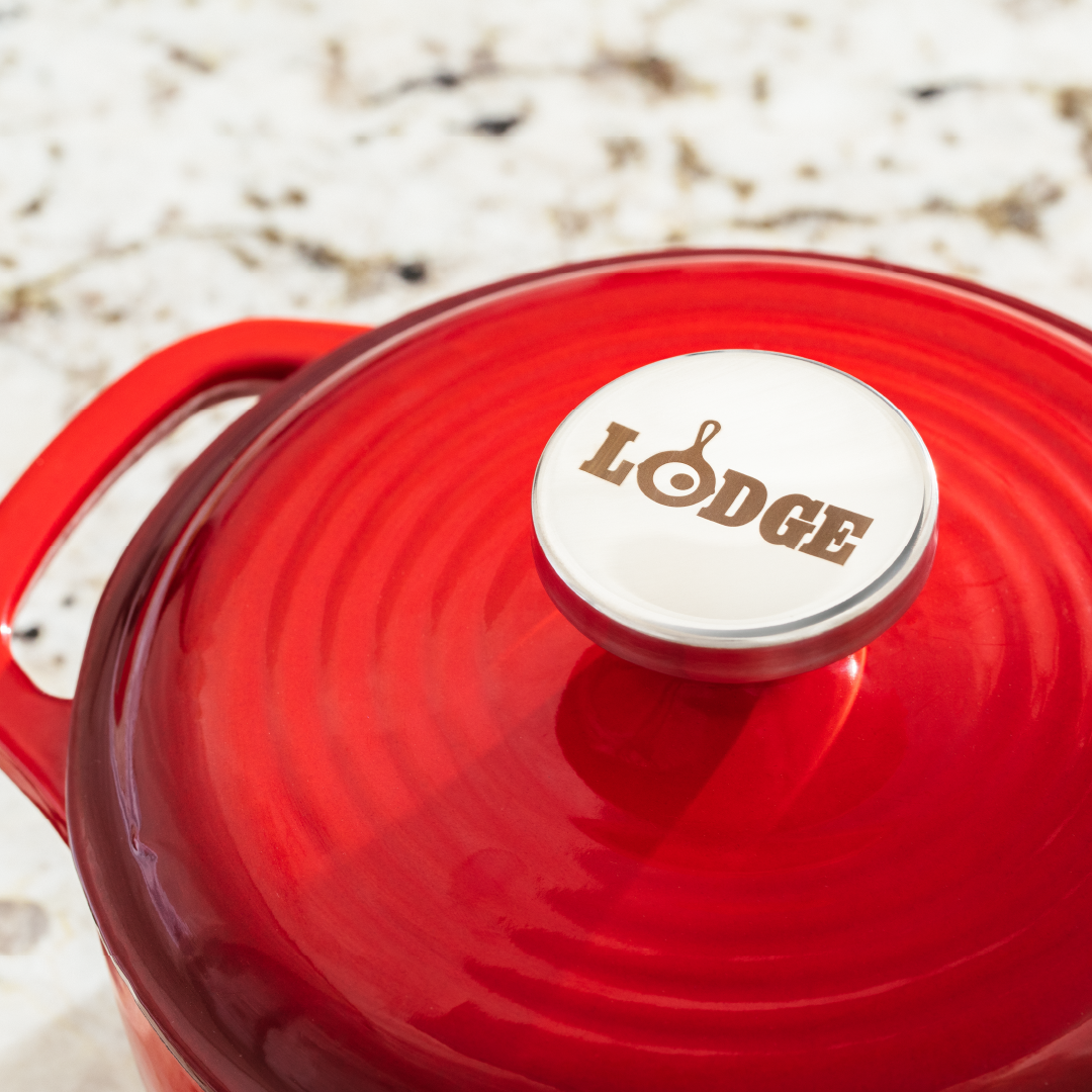 Close up of lid featuring silver knob with Lodge branding.
