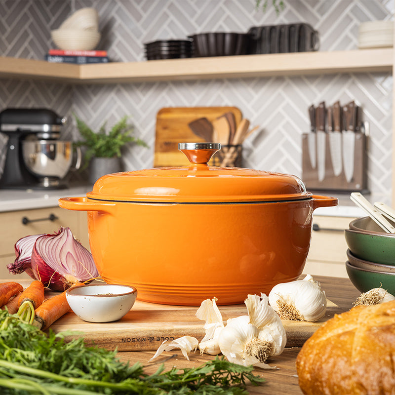Dutch oven on kitchen counter near prepped ingredients.