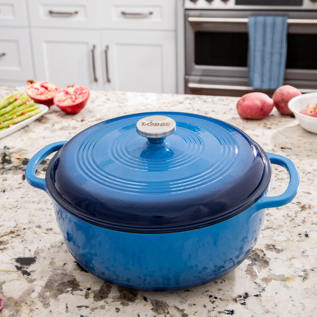 Dutch oven on kitchen counter near prepped ingredients.
