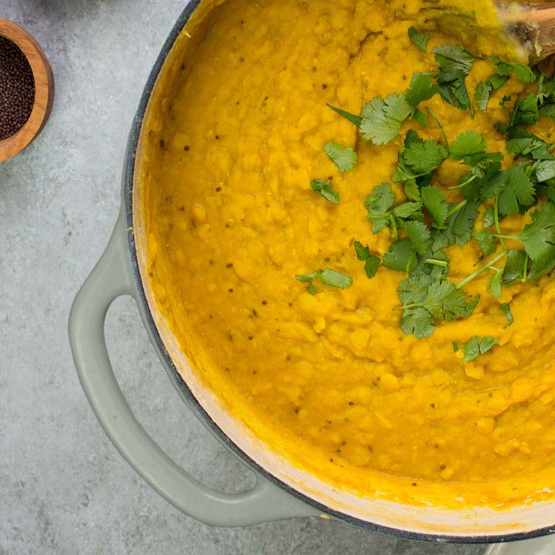 Yellow lentil curry made in dutch oven.