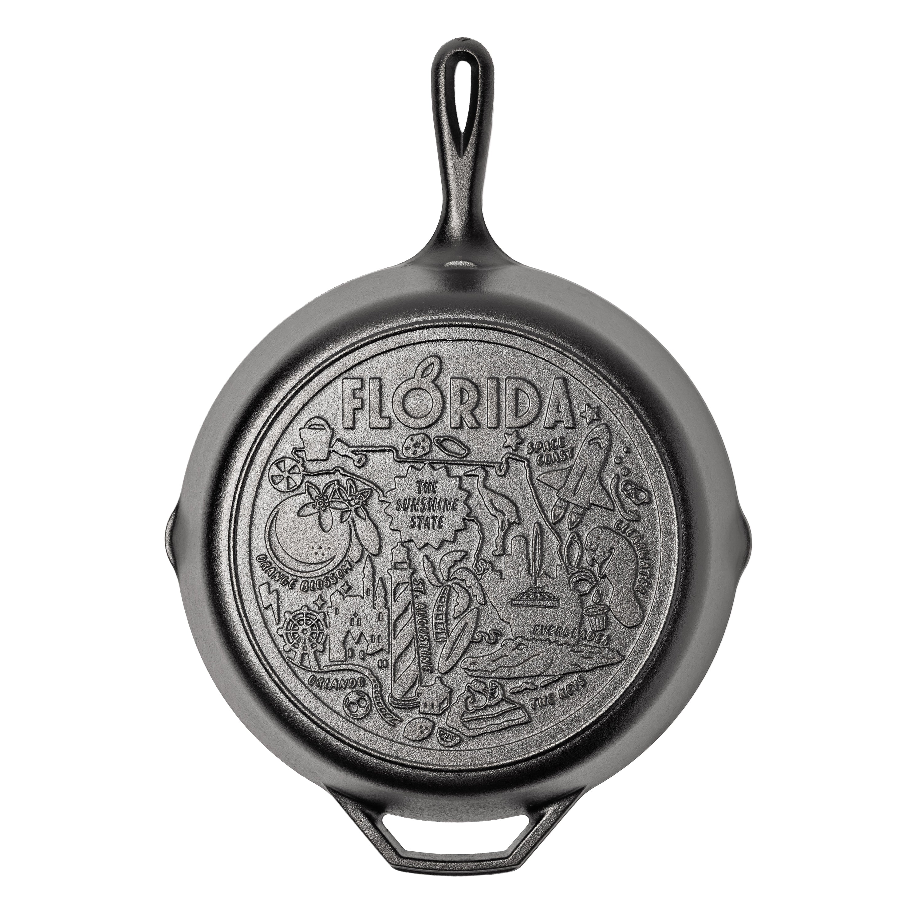 Cast iron skillet with the bottom engraved with beloved icons and monuments from Florida.