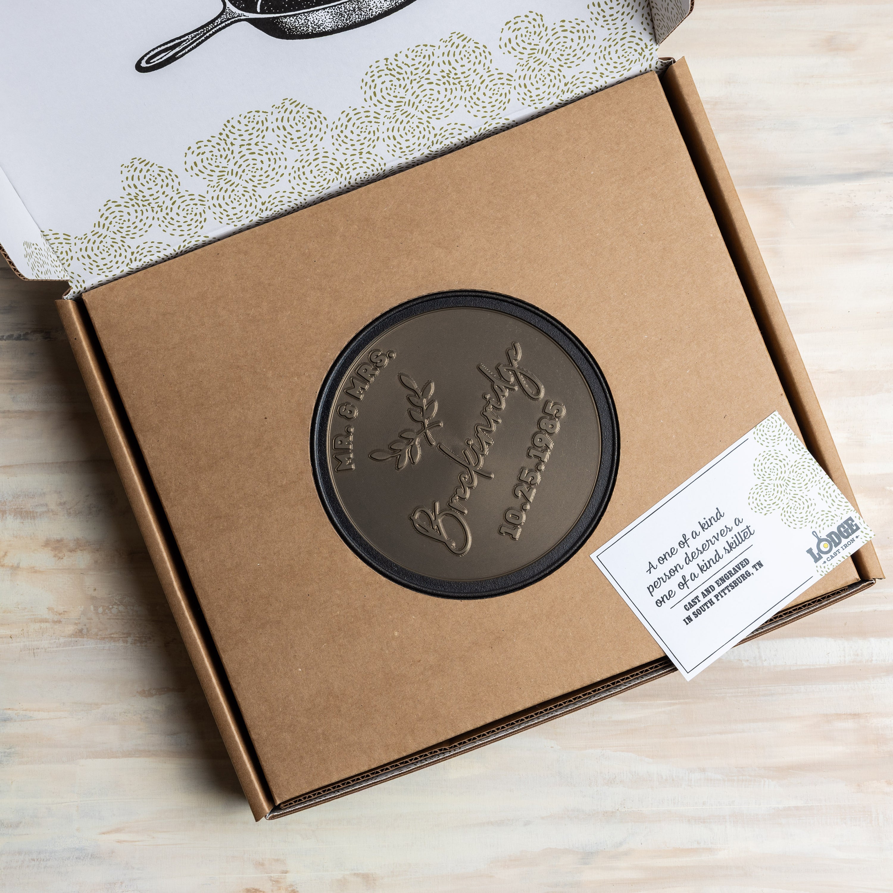 Sample Custom skillet in packaging, with a hole in the middle to display design.