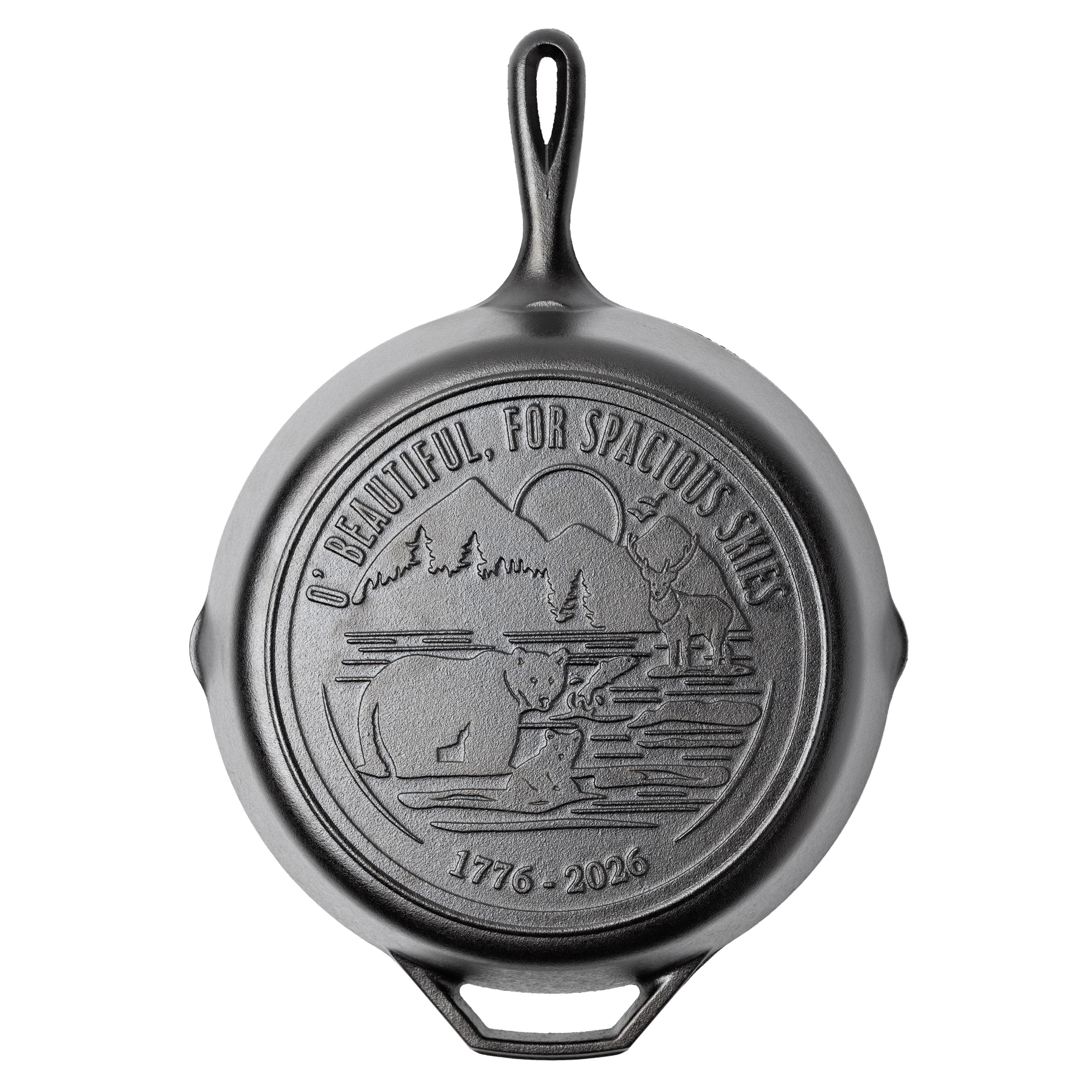 Cast iron skillet with back engraved featuring lyrics and imagery from America The Beautiful.
