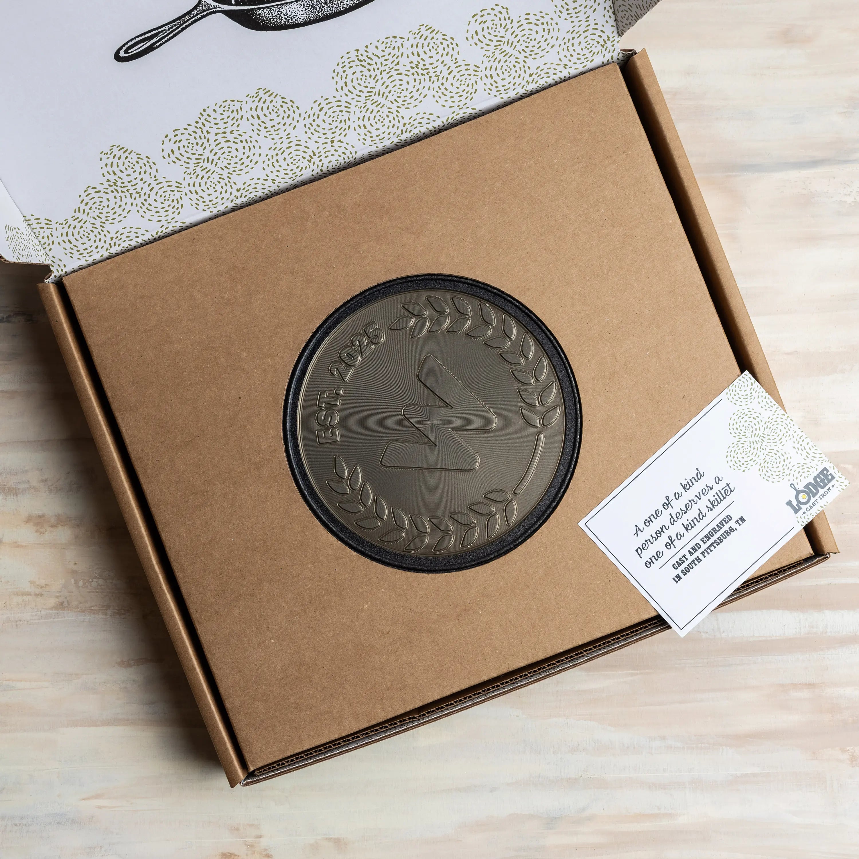 Sample Custom skillet in packaging, with a hole in the middle to display design.