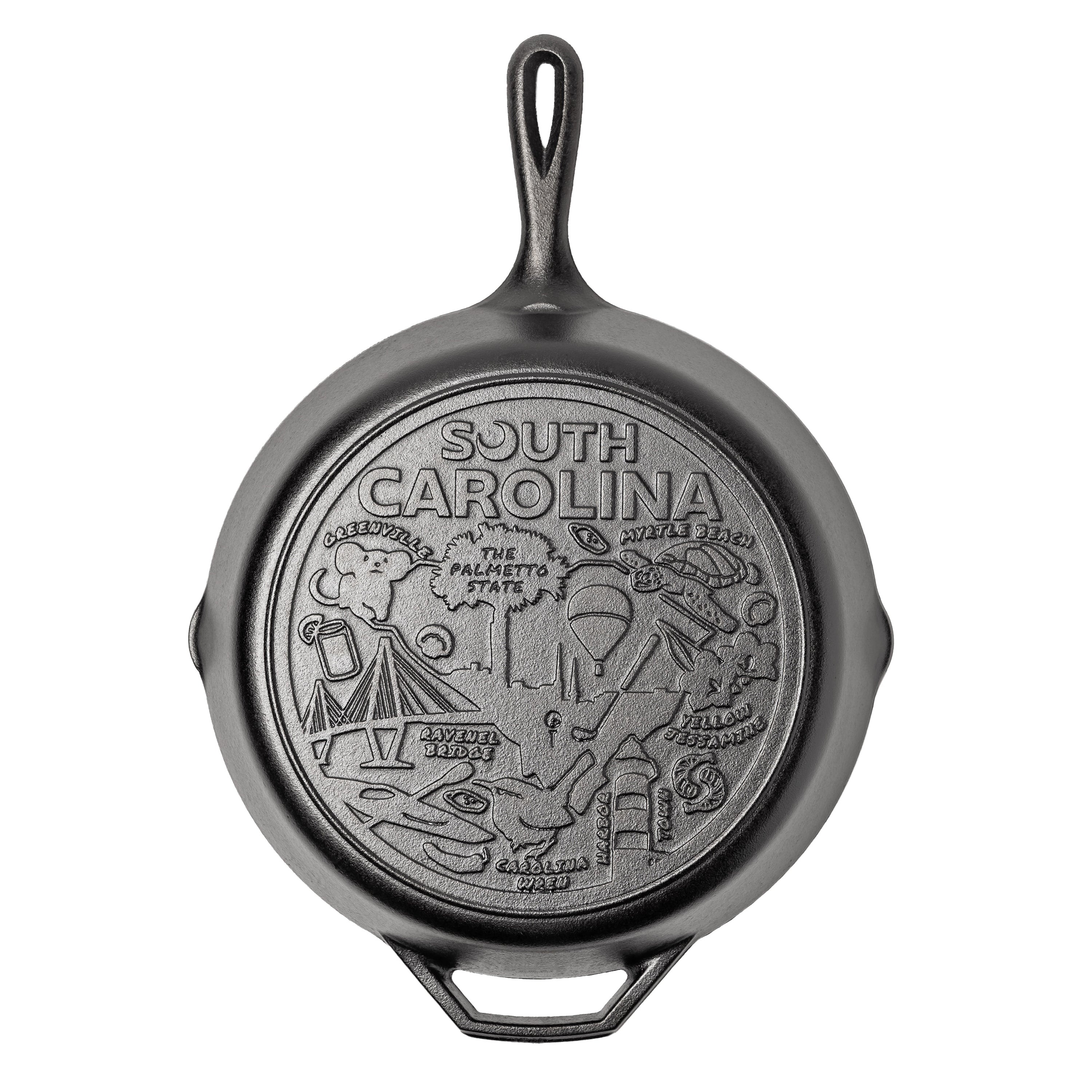 Cast iron skillet with the bottom engraved with beloved icons and monuments from South Carolina.