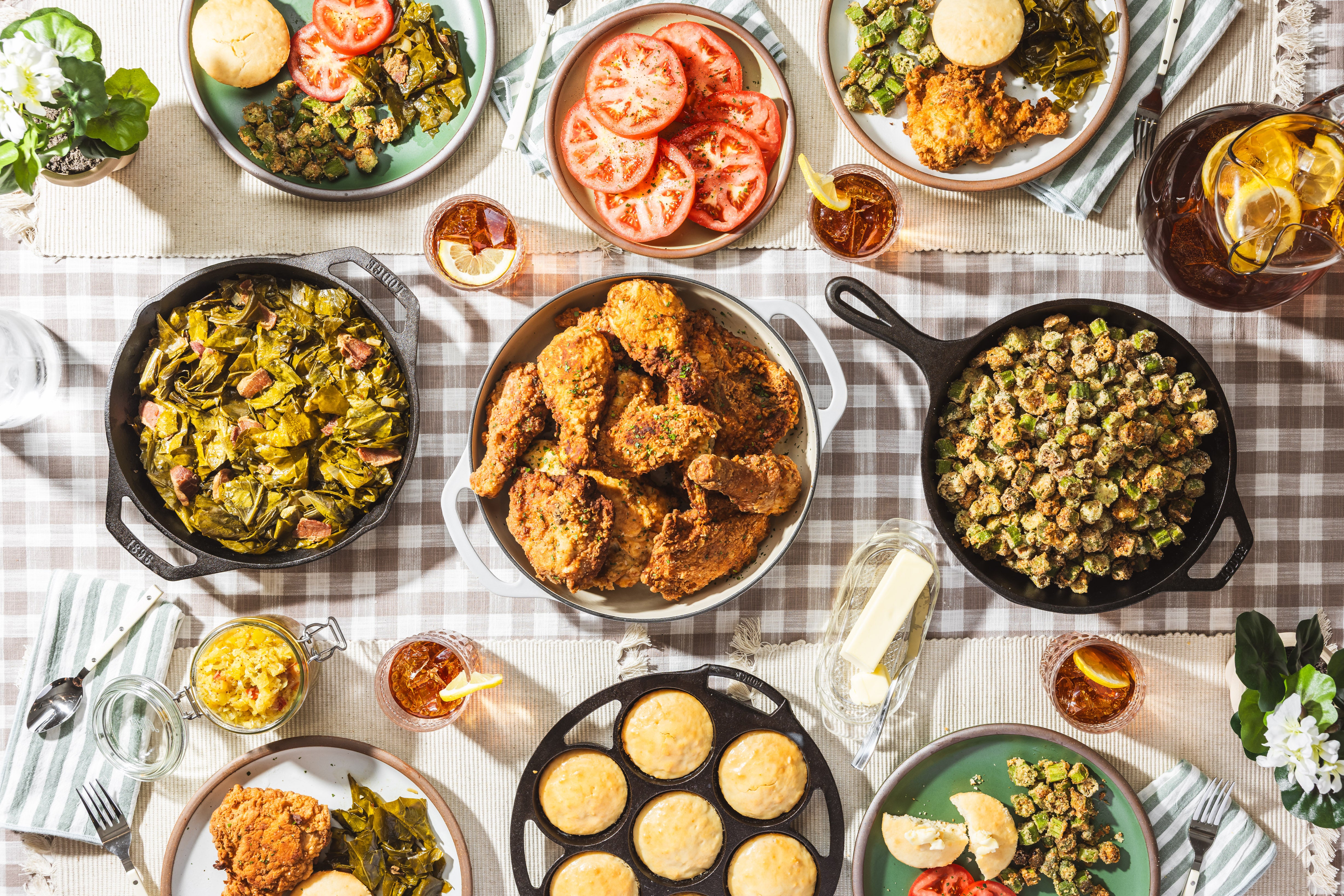 Diverse array of Southern-style dishes on a checkered tablecloth