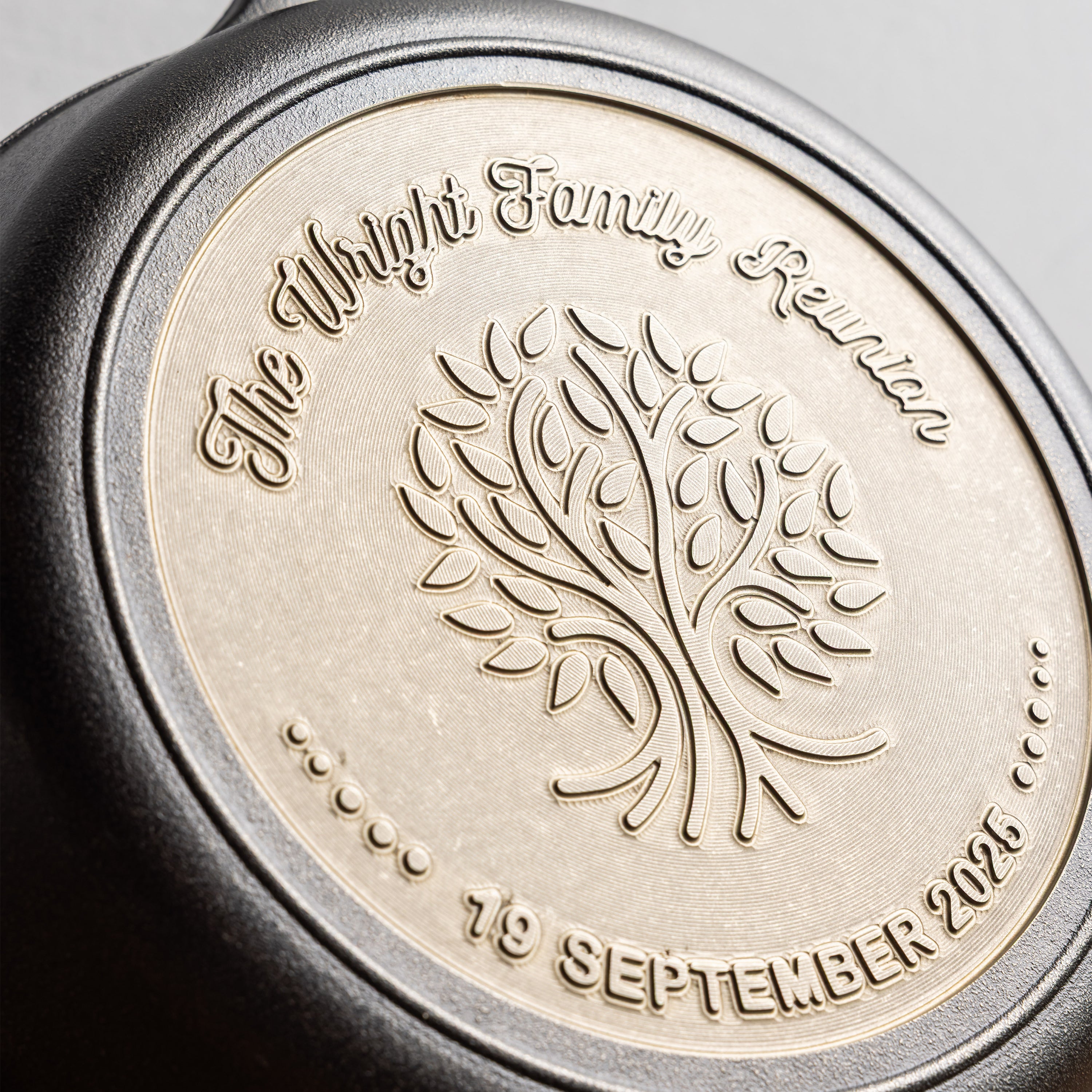 Close-up of engraved design using a cursive font.