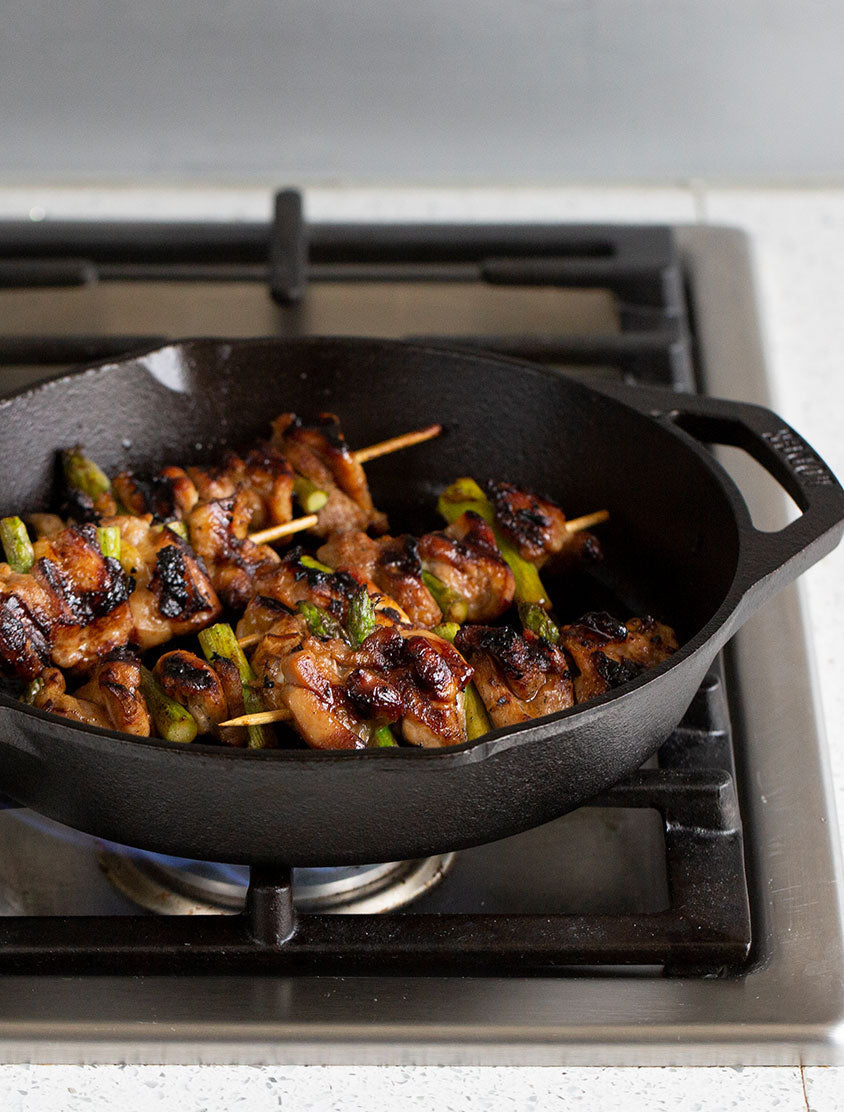 Skewers cooking in skillet