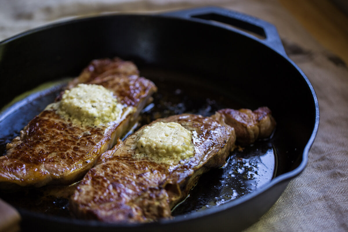 Seared steak topped with butter