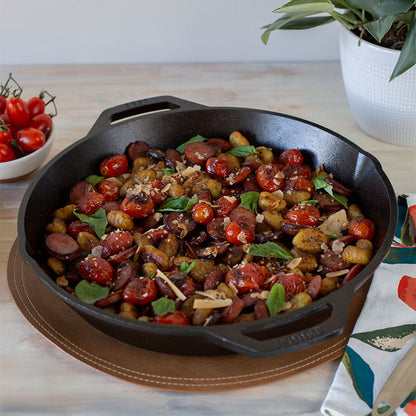 Freshly made dish with sausage, tomato's, potato's, and basil.