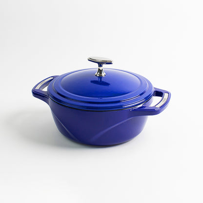 Blue enameled cast iron Dutch oven with a lid on a white background