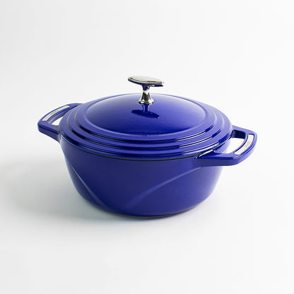 Blue enameled cast iron Dutch oven with a lid on a white background