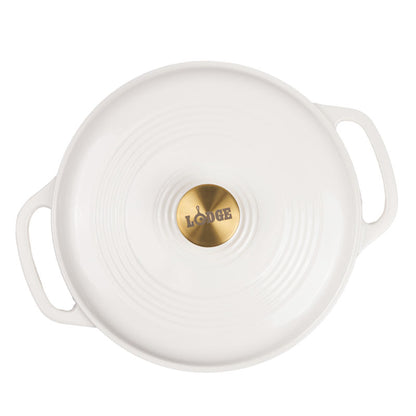 Top view of lid featuring gold knob with Lodge branding.