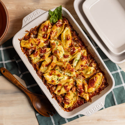 Freshly baked pasta in rectangular stoneware baking dish.