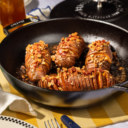 Hasselbeck potatoes freshly prepared in braiser.