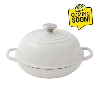 Oyster enameled bread oven with 2 handles on the base and a silver knob on lid. Image features a badge saying "Coming Soon".