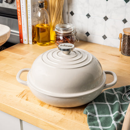 Oyster colored bread oven on kitchen table.