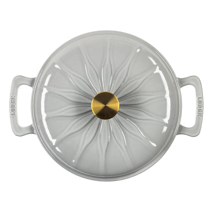 A top-down view of braiser with a matching lid, featuring a central gold knob and side handles.