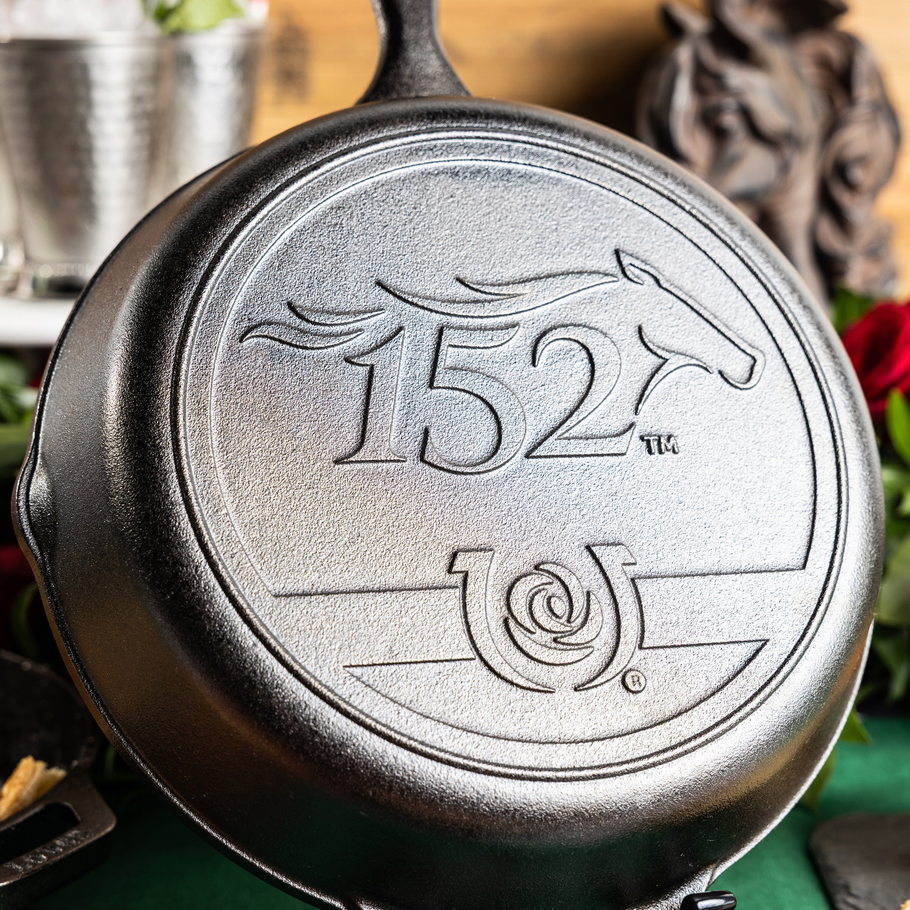 Close up of the 152nd Kentucky Derby logo on a cast iron skillet.