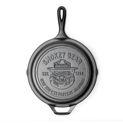 Cast iron skillet with Smokey Bear logo on bottom.