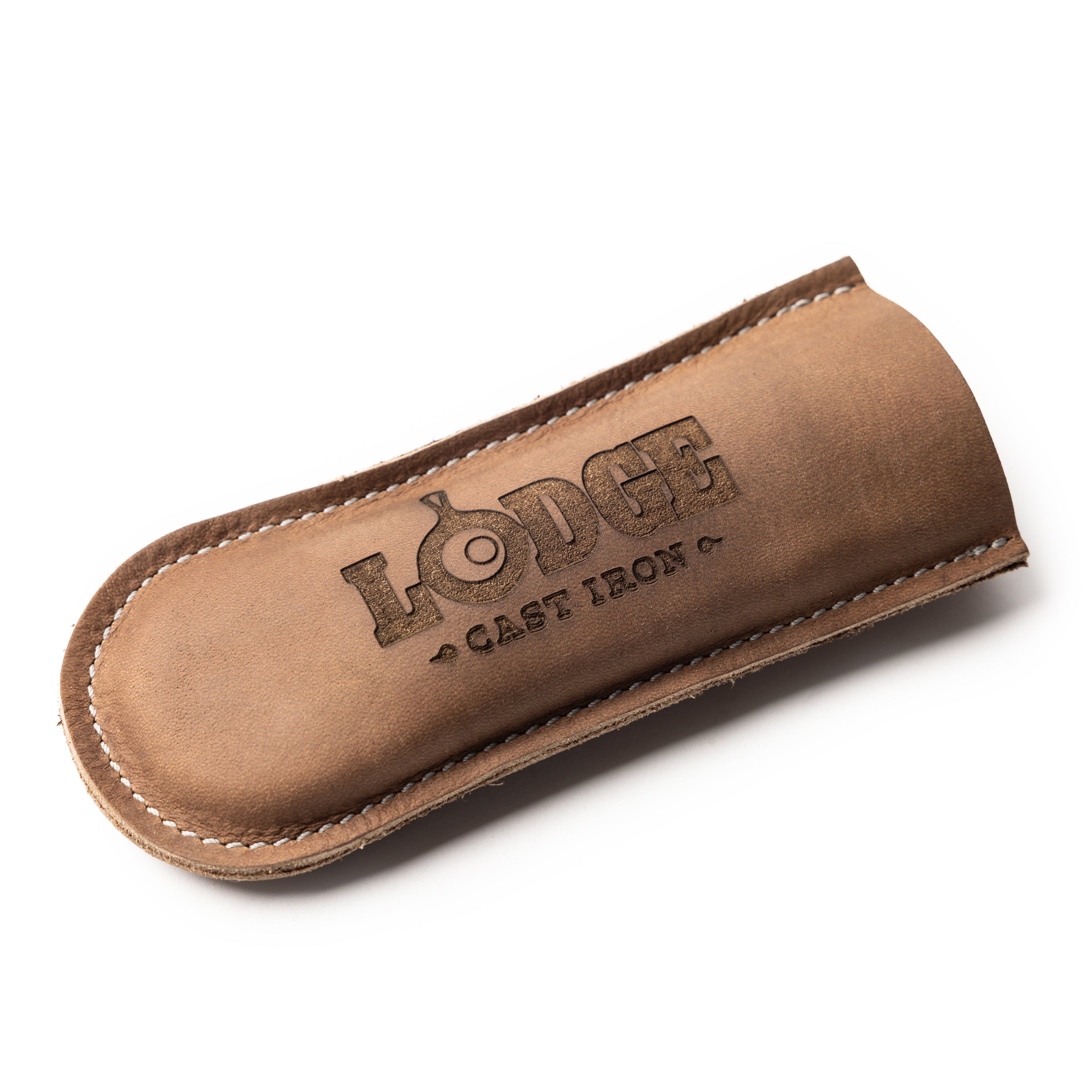A brown leather handle holder with white stitching and an embossed logo that reads 'LODGE CAST IRON', shown on a clean white background.