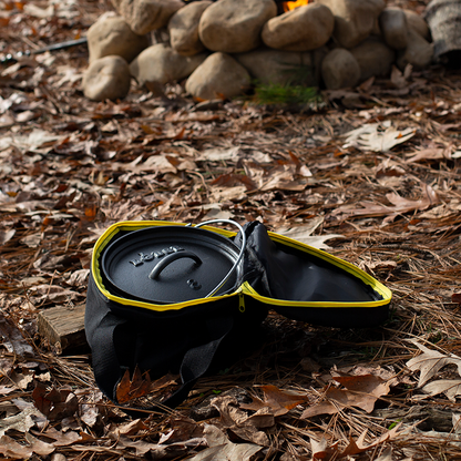 Camp dutch oven inside tote bag with top open at campsite.