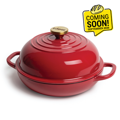 Red enameled bread oven with 2 handles on the base and a silver knob on lid. Image features a badge saying "Coming Soon, September 2026".