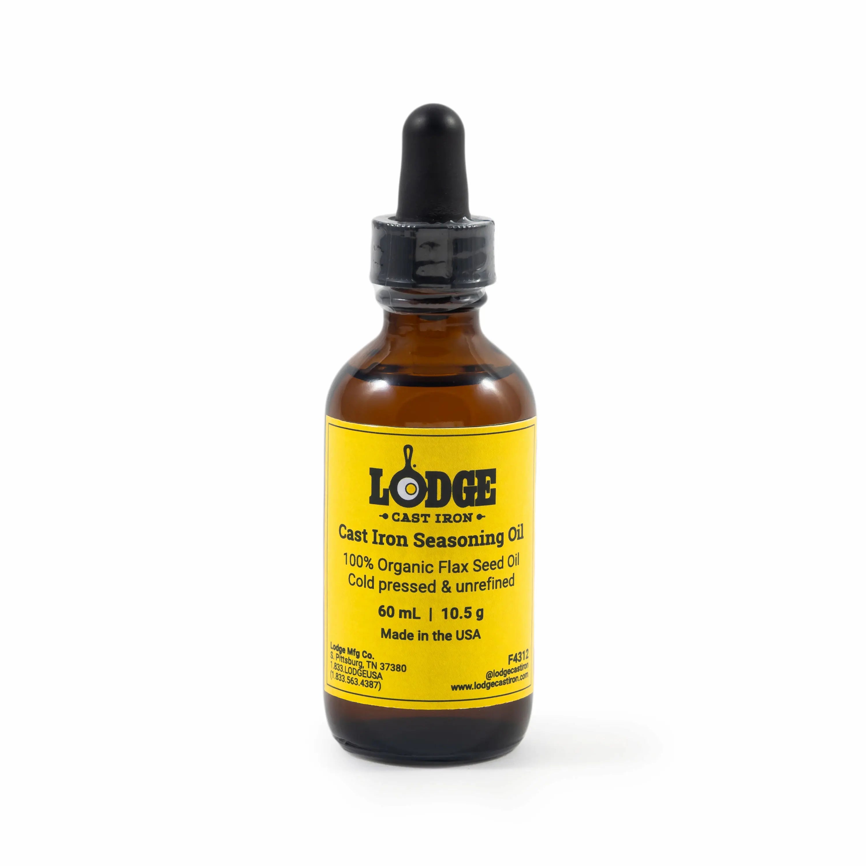 Glass bottle with squeeze syringe of Lodge Cast Iron Seasoning Oil.