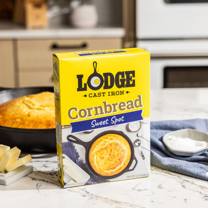 Lodge Cornbread mix box with a cornbread loaf in the background
