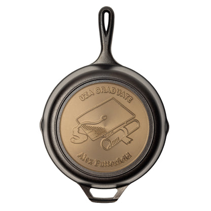 Custom engraved skillet list the school and graduates name in the editable fields.