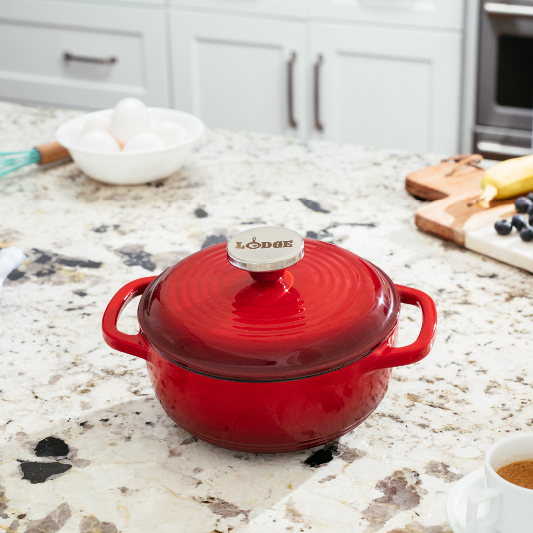 Dutch oven on kitchen counter near prepped ingredients.
