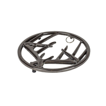 Black midnight chrome enamel trivet with decorative antler design on a white background