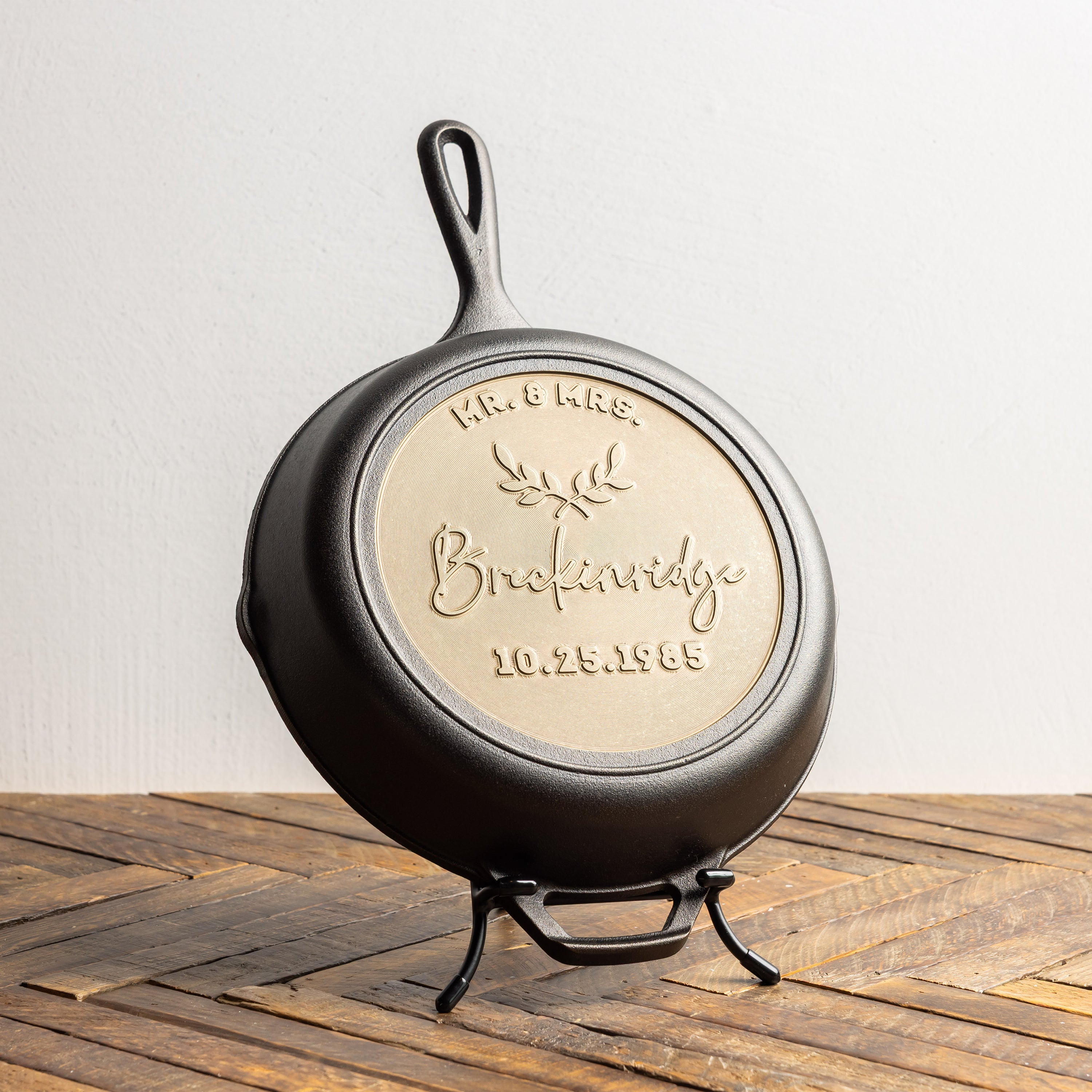 Personalized skillet, displayed on stand to commemorate a wedding. 