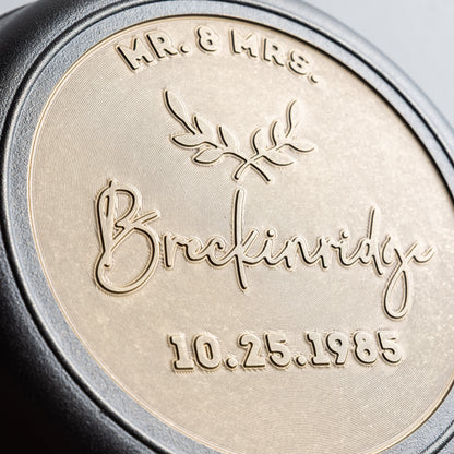 Close-up of personalized wedding skillet with "Mr. & Mrs." in top arc field, the couples last name in cursive for the middle field, and the wedding date underneath.