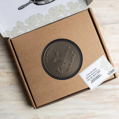 Sample Custom skillet in packaging, with a hole in the middle to display design.