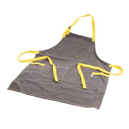 Apron laid out, displaying 3 pockets, neck strap, and back ties.