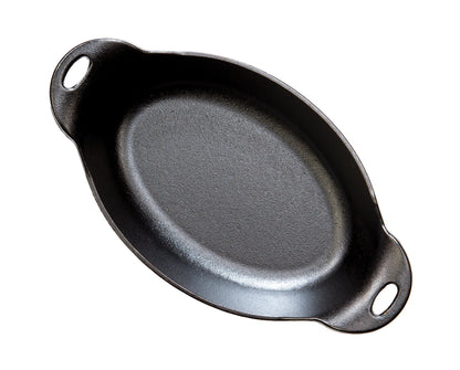 Top view of A black cast iron oval server with two handles.