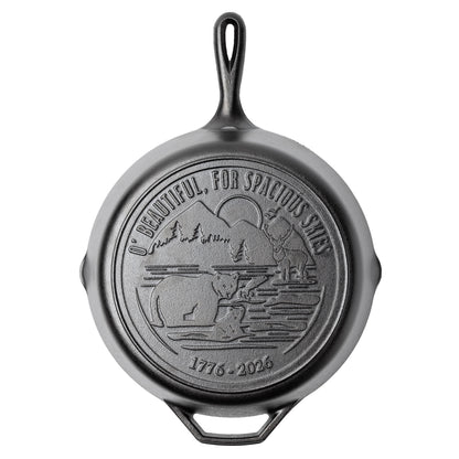 Cast iron skillet with back engraved featuring lyrics and imagery from America The Beautiful.