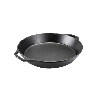 Black cast iron skillet with two loop handles.
