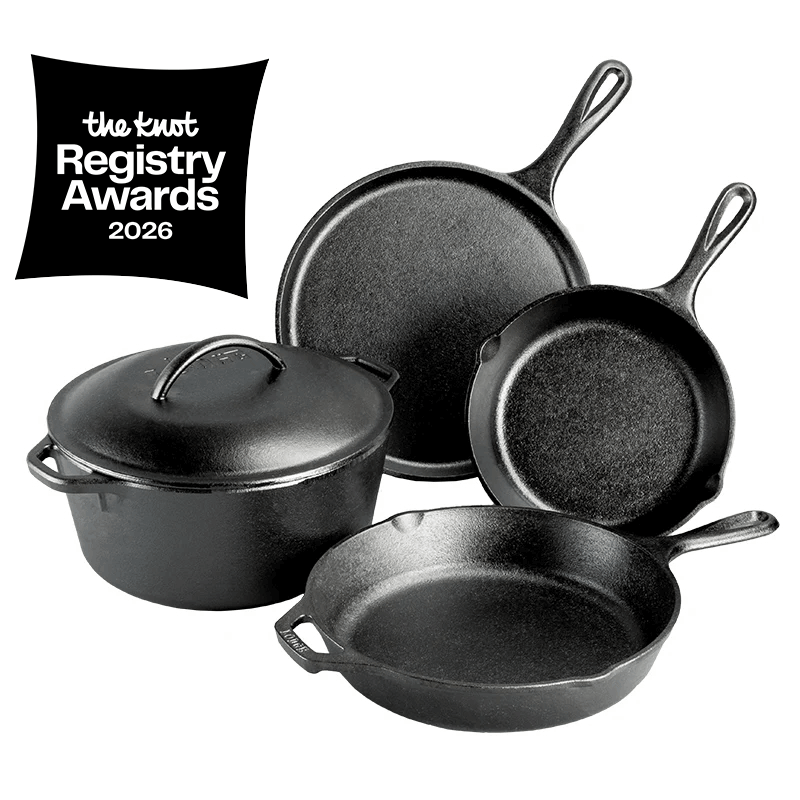 A set of seasoned black cast iron cookware, including a Dutch oven with lid, a griddle, a skillet, and another smaller skillet. Features a badge for "The Knot Registry Awards".