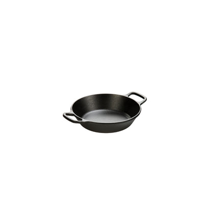 Black cast iron skillet with two loop handles.