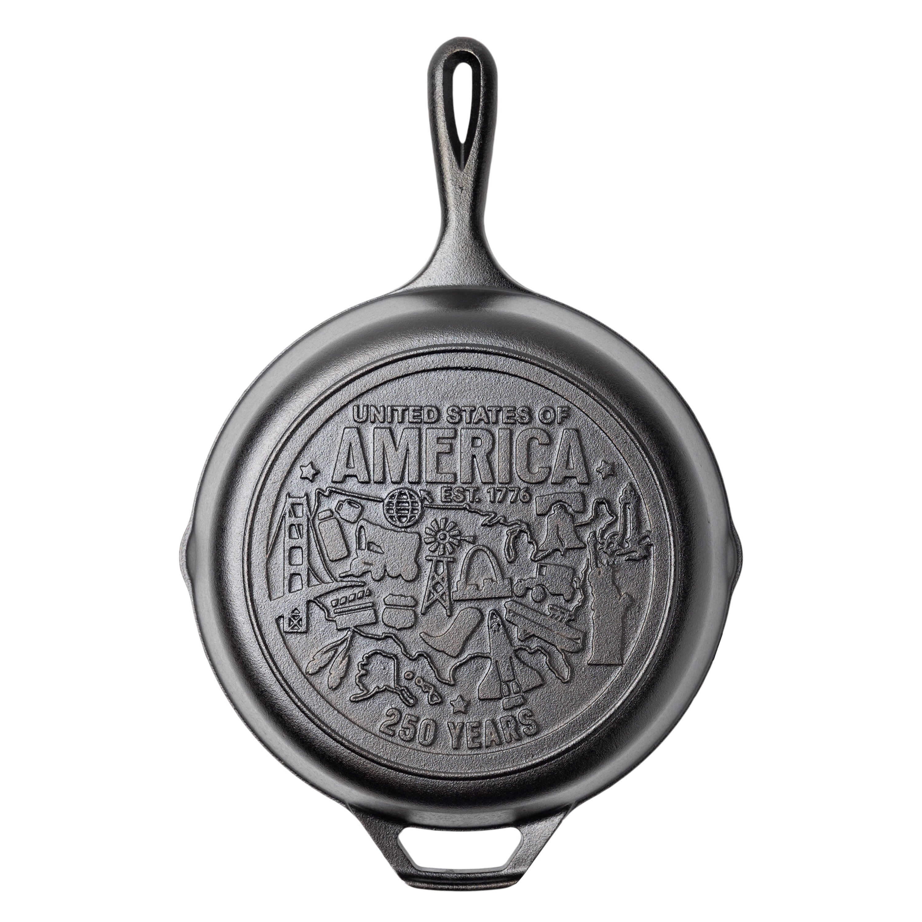 Cast iron skillet with engraved design on back featuring monuments and icons from around the country.