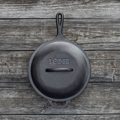 Top view of lid on skillet, displaying branding and handle.