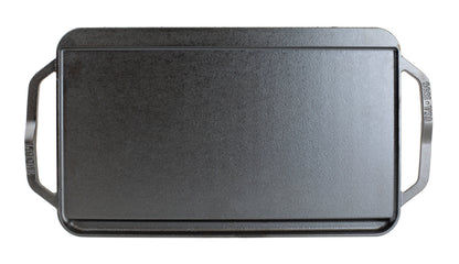 Top view featuring the griddle side showing slot for grease to fall and a constructed handle shape for easy use on each side.