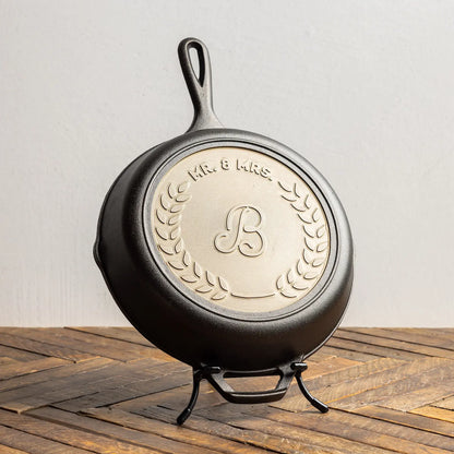 Personalized sample skillet on display stand.